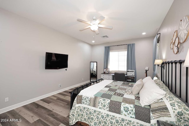 bedroom with hardwood / wood-style flooring and ceiling fan