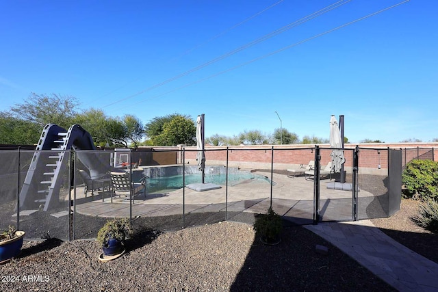 view of swimming pool featuring a patio