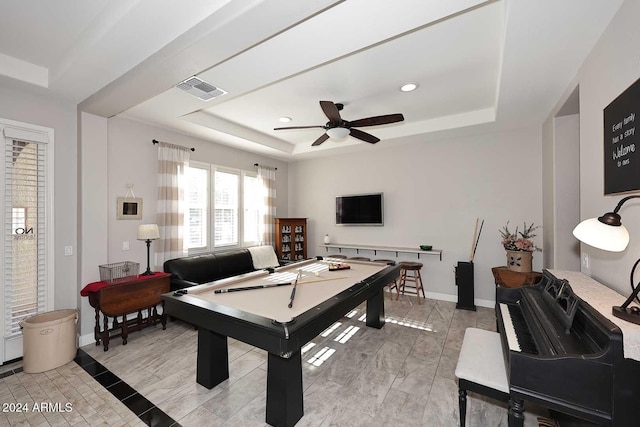 recreation room with ceiling fan, a raised ceiling, and pool table