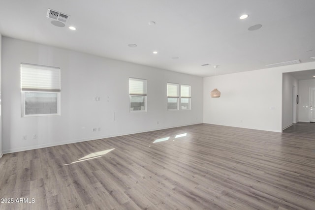 spare room featuring light hardwood / wood-style flooring