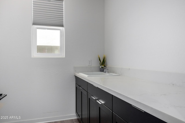 bathroom with vanity and hardwood / wood-style floors