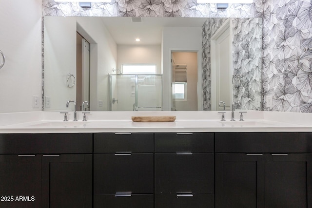 bathroom featuring vanity and a shower with shower door