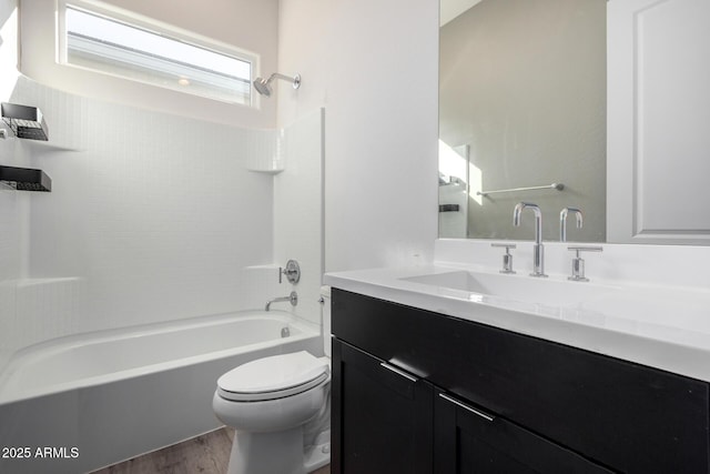 full bathroom with shower / bath combination, vanity, hardwood / wood-style floors, and toilet