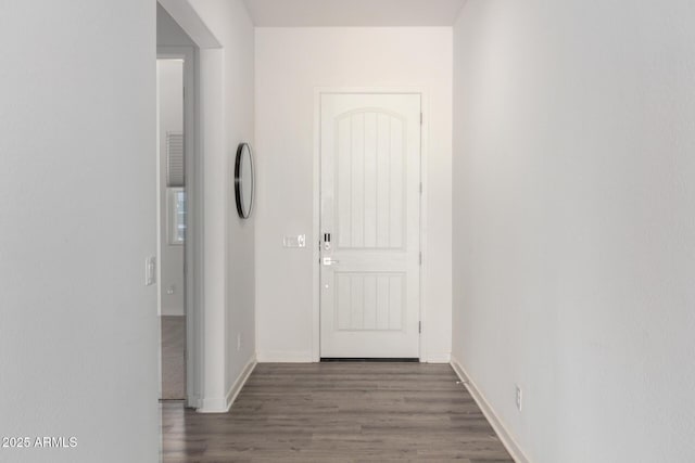 corridor featuring dark hardwood / wood-style floors