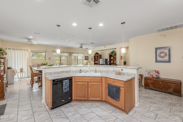 kitchen with ceiling fan, sink, pendant lighting, a spacious island, and dishwasher