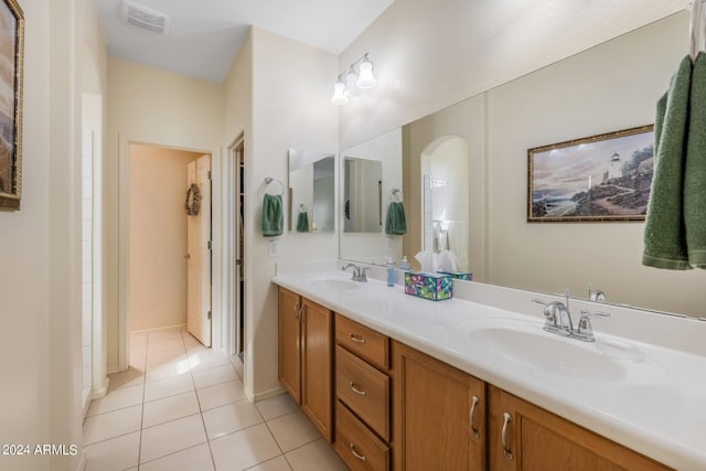 bathroom with tile patterned flooring and vanity