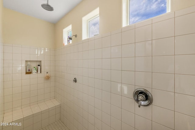 bathroom featuring tiled shower