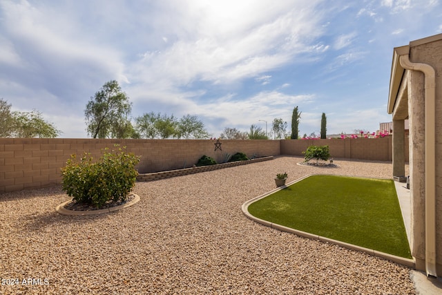 view of yard with a fenced backyard