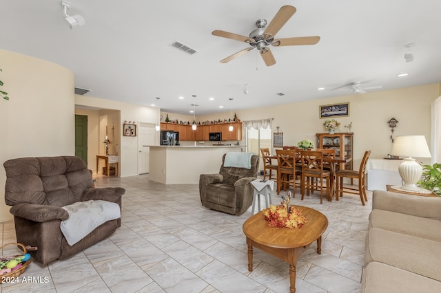 living area with ceiling fan, marble finish floor, visible vents, and recessed lighting