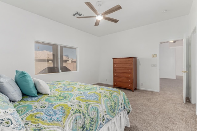 bedroom with light carpet and ceiling fan