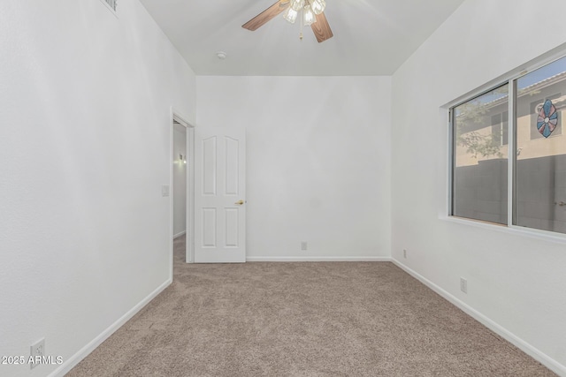 unfurnished room with light carpet and ceiling fan