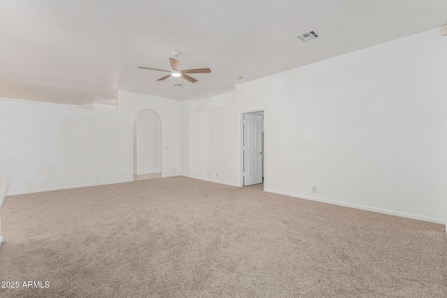 unfurnished room with light colored carpet and ceiling fan