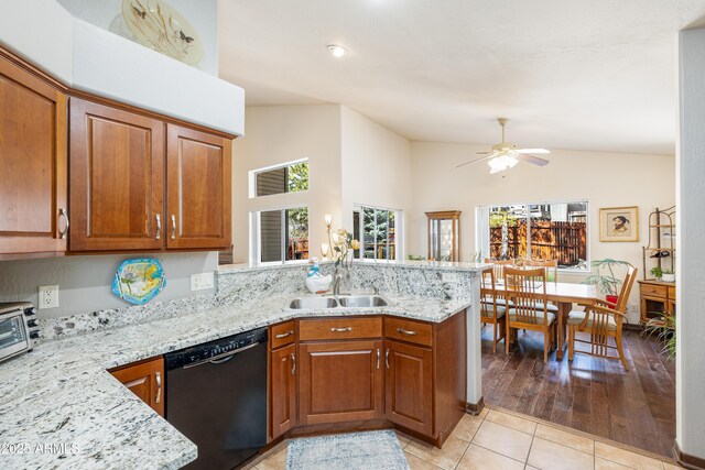 630 W Cattle Drive Trl, Flagstaff, AZ 86005 - kitchen with light tile patterned floors, a peninsula, black dishwasher, a sink, and brown cabinets