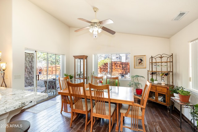 630 W Cattle Drive Trl, Flagstaff, AZ 86005 - dining room featuring high vaulted ceiling, dark wood-style flooring, ceiling fan, and visible vents