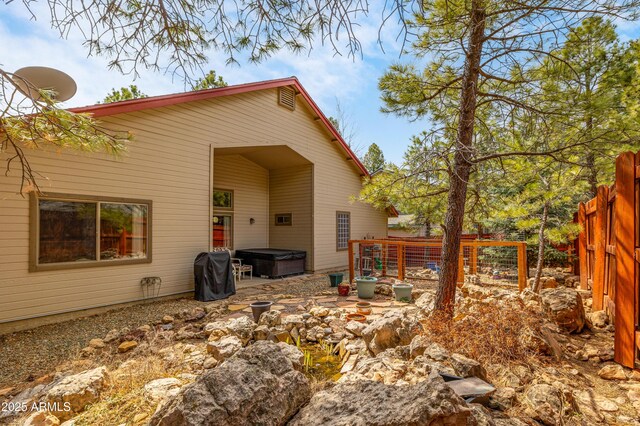 630 W Cattle Drive Trl, Flagstaff, AZ 86005 - back of house with fence and a hot tub