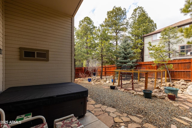 630 W Cattle Drive Trl, Flagstaff, AZ 86005 - view of yard featuring a fenced backyard, a patio area, and a hot tub
