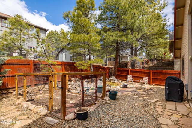 630 W Cattle Drive Trl, Flagstaff, AZ 86005 - view of yard featuring an outdoor fire pit and a fenced backyard