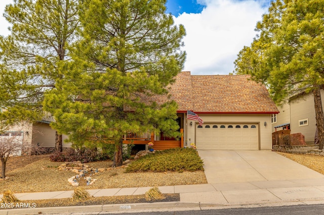 630 W Cattle Drive Trl, Flagstaff, AZ 86005 - view of front facade with a garage, roof with shingles, and driveway