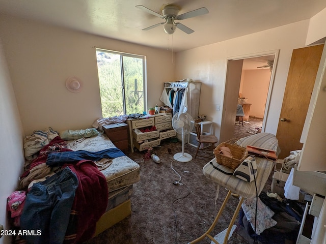 miscellaneous room featuring ceiling fan and dark carpet