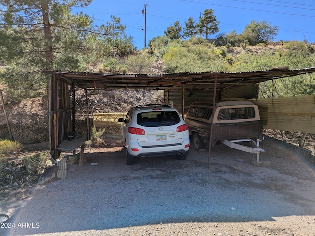 view of parking / parking lot featuring a carport