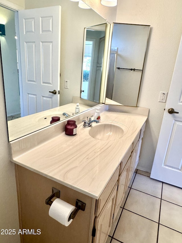 bathroom with vanity and tile patterned floors