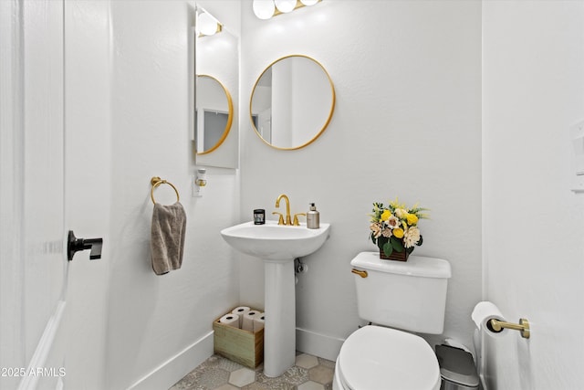 10415 E Rosemary Ln, Scottsdale, AZ 85255 - half bath with baseboards and toilet