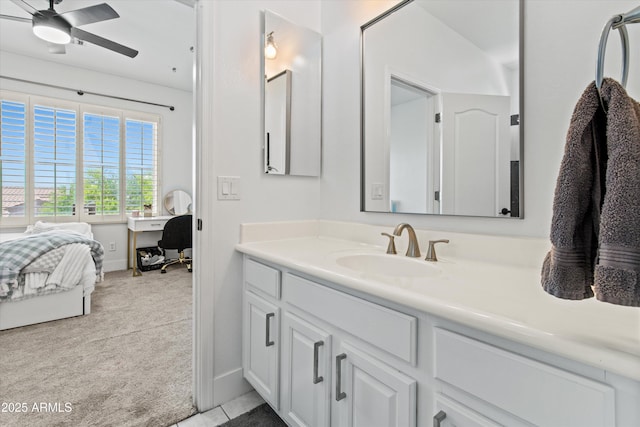 10415 E Rosemary Ln, Scottsdale, AZ 85255 - bathroom with vanity, a ceiling fan, baseboards, and ensuite bath