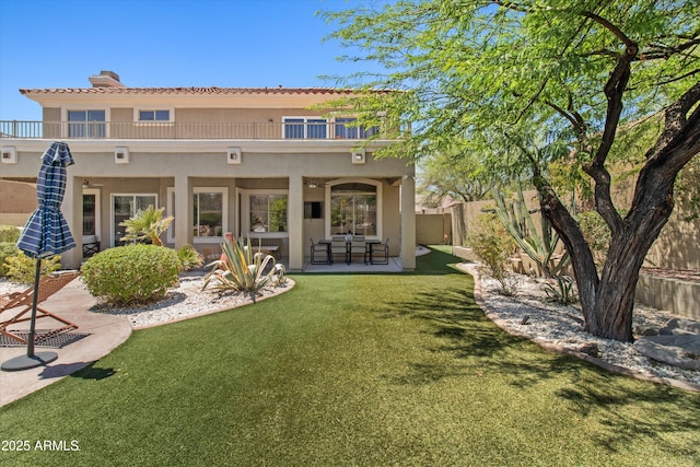 10415 E Rosemary Ln, Scottsdale, AZ 85255 - rear view of property featuring stucco siding, a balcony, a ceiling fan, and a patio