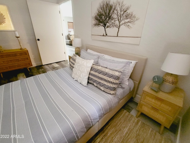 bedroom with wood finished floors