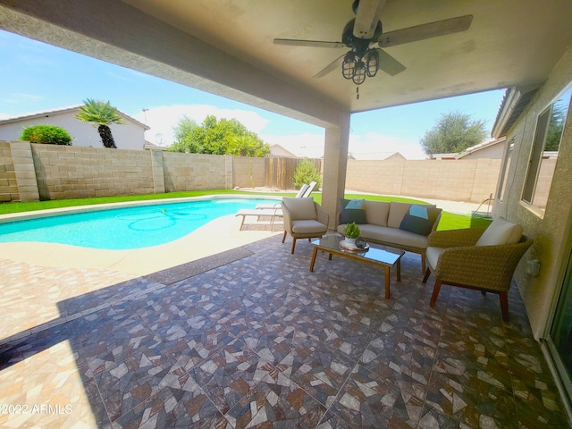 view of swimming pool with a fenced in pool, a fenced backyard, a patio, and outdoor lounge area