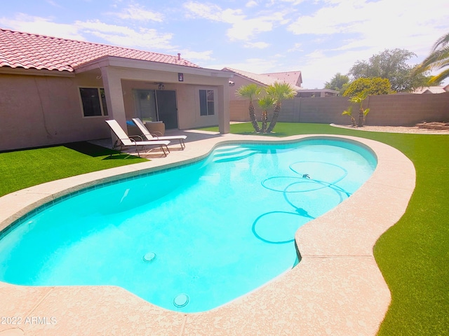 view of swimming pool with a patio area, a fenced backyard, and a fenced in pool