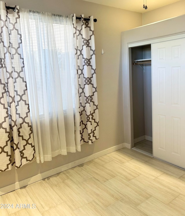 unfurnished bedroom featuring a closet