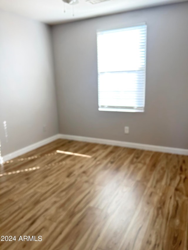 empty room featuring hardwood / wood-style floors