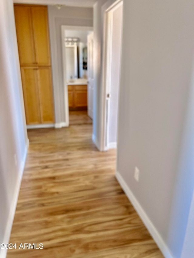 hallway featuring light hardwood / wood-style floors