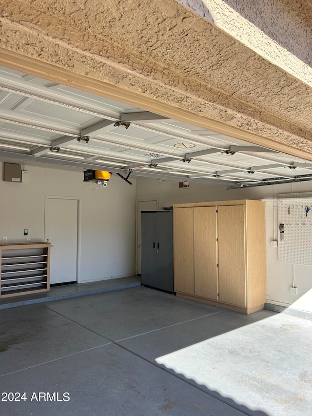 garage featuring a garage door opener