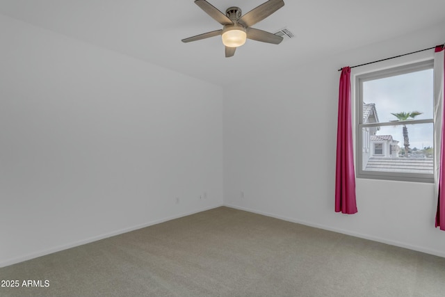 unfurnished room with a ceiling fan, baseboards, visible vents, and carpet flooring