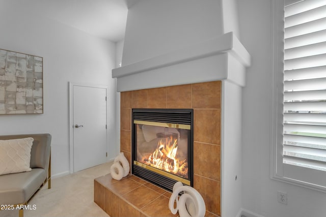 room details with carpet flooring and a tiled fireplace