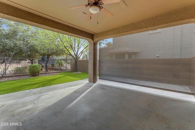 view of patio with a fenced backyard and ceiling fan