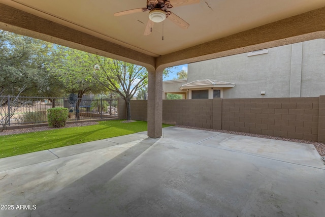 view of patio / terrace with a fenced backyard and ceiling fan