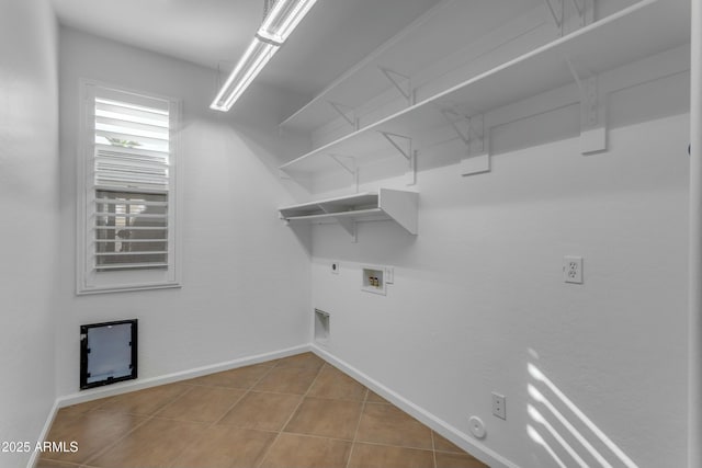 clothes washing area featuring hookup for a washing machine, laundry area, gas dryer hookup, and baseboards