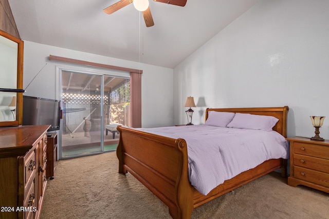 bedroom featuring ceiling fan, access to exterior, vaulted ceiling, and light colored carpet