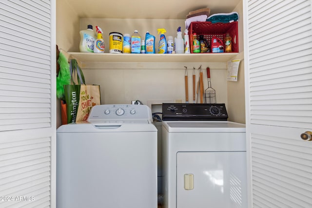 washroom with washing machine and dryer