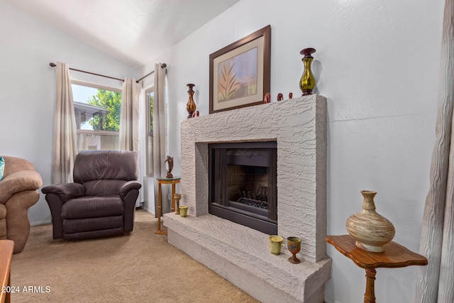 sitting room featuring light carpet and lofted ceiling