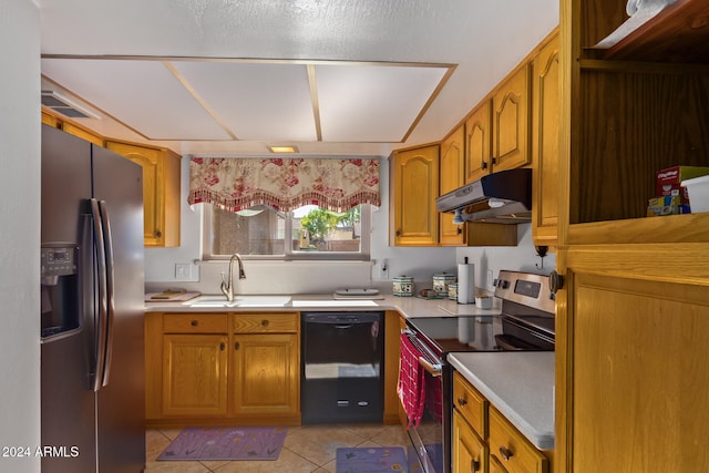 kitchen featuring sink, light tile patterned floors, and stainless steel appliances