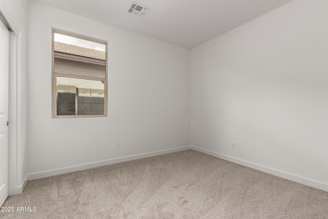 unfurnished room featuring visible vents, baseboards, and carpet floors