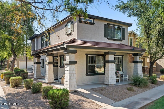 view of front facade featuring a porch and stucco siding