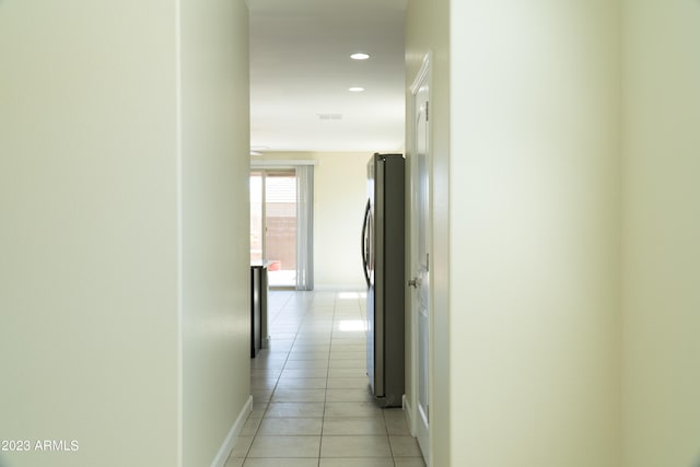 corridor with light tile patterned floors