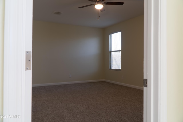 carpeted empty room with ceiling fan