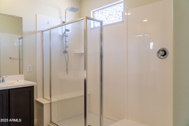 bathroom featuring vanity and walk in shower