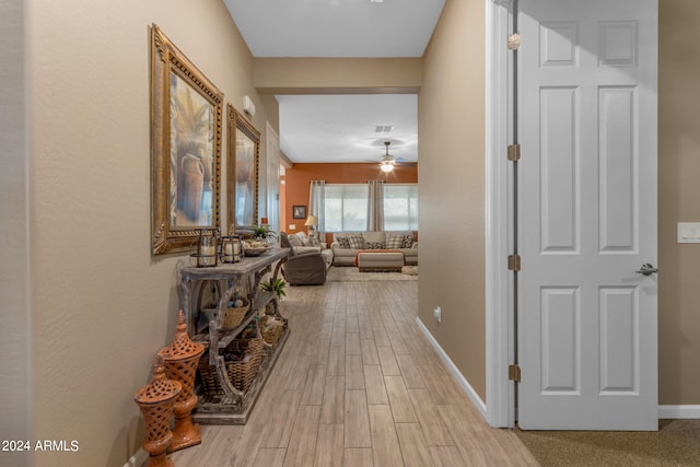 hall with light hardwood / wood-style floors